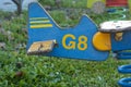 Seesaw swing in the shape of a wooden plane with spring in children is playground detail of the tail
