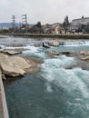 Mzymta river with rapids and boulders in the Krasnaya Polyana area of Sochi in the evening in early March