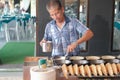 Segamat , Malaysia - May 28th, 2022 : Unidentified man making famous Malaysian street food pancake called Royalty Free Stock Photo