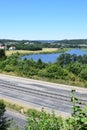 Autobahn with some road damage and a lake next to it, A1 in Germany Royalty Free Stock Photo