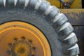 Segment of large tire on road grader Royalty Free Stock Photo