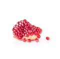 Segment of ripe pomegranate with seeds isolated on white background.