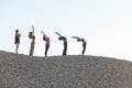 segment of yoga sun salutation cycle performed by five women