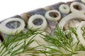 Segments of salty herring with onion and fennel
