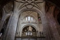 Segovia Cathedral symmetrical inside view of the decorative Gothic vaults with floral carvings, Spain.