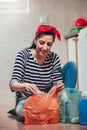 Segregating waste,a daily routine of smiling woman Royalty Free Stock Photo