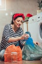 Segregating waste,a daily routine of smiling woman Royalty Free Stock Photo