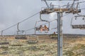 View of a couple and daughter enjoying the view on cable car railway circuit, top at the mountains of the Serra da Estrela natural Royalty Free Stock Photo