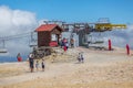 View of rolling system and cable fixing of cable car railway circuit or Aerial tramway, tourist people and ticket cabin on top at