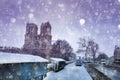 Seine bank and Notre Dame de Paris under snow Royalty Free Stock Photo