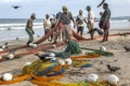 Seine fishermen pull their fishing nets from the Indian Ocean onto Uppuveli beach in Sri Lanka. Royalty Free Stock Photo