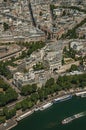 Seine River boats, greenery and buildings in a sunny day, seen from the Eiffel Tower top in Paris. Royalty Free Stock Photo