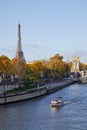 Seine river view with boat, Eiffel tower and Alexander III bridge in a sunny day in Paris Royalty Free Stock Photo