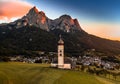 Seis am Schlern, Italy - Aerial view of St. Valentin Church and famous Mount Sciliar mountain at background at sunset Royalty Free Stock Photo