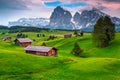 Seiser Alm resort and wooden chalets at sunset, Dolomites, Italy Royalty Free Stock Photo