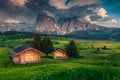 Seiser Alm resort with wooden lodges at sunset, Dolomites, Italy Royalty Free Stock Photo
