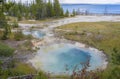 Seismograph pool with steamy water sits near Yellowstone Lake in Yellowstone National Park at West Thumb Geyser Basin.
