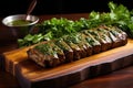 seitan steak with chimichurri sauce on a wooden platter