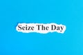 Seize The Day text on paper. Word Seize The Day on torn paper. Concept Image Royalty Free Stock Photo