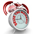 Seize the moment. The alarm clock with an inscription Royalty Free Stock Photo
