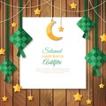 Selamat Hari Raya greeting card on wood