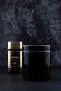 Selangor, Malaysia - April 2020: Nescafe gold instant coffee in a jar with black cup over dark background Royalty Free Stock Photo