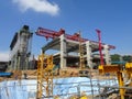 An elevated road is under construction. Reinforced concrete is used for the structure.