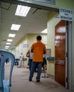 Selan Signage to queue written in Malay hanging at the Serdang Hospital during vaccination process