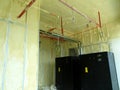 Polyurethane insulating foam that has been sprayed and covered the concrete slabs and walls surface.