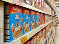 Cereals of various flavors from various brands as breakfast food. Packed in a commercial box and displayed for customers