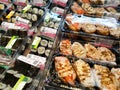 Various types of Japanese sushi ready in packs are on display for sale. Royalty Free Stock Photo