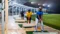 Unidentified people playing golf at Puncak Alam Golf Driving Range during the night