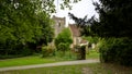 Spring afternoon light View of St Mary`s Church in Selborne from the village green near the Pleistor House, Hampshire, UK Royalty Free Stock Photo