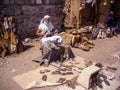 Selcuk, Turkey - June 18 2012 : Actor posing as old artisan shoe maker in Ephesus Ancient City, near Kusadasi. UNESCO World Herita