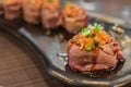 Select focus of beef sushi gunkan maki with salmon paste topping ready to serve