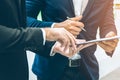 Selected focus on businessman hand pointing on the document, letting the partner sign on the paper for business agreement or Royalty Free Stock Photo