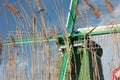 Selected focus of a closeup of detail of the turbine blades of a traditional green windmill of Zaanse Schans