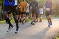 Selected focus group of marathon people jogging in the park in morning.