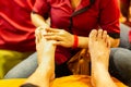 Selected focus hand on tourist foot doing foot massage. in Cambodia at night.
