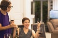 Selected focus happy woman with mother drinking red wine enjoy distant talk via video call.