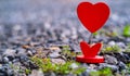 Selected Focus Image of Heart Stand Display on the Ground with Bokeh on the Back for Valentine Theme or Valentine Card