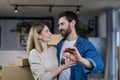 Selected focus, married couple man and woman happy together, hugging, holding the keys to their new apartment, housewarming, close Royalty Free Stock Photo