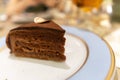 selected focus, Piece of chocolate cake on white plate in cafe. Delicious sweet cake on table Royalty Free Stock Photo