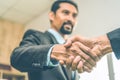 Selected focus on two businessman hands shake in the meeting room. Businessmand hand shake as a greeting Royalty Free Stock Photo