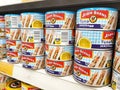 Selected focused on tuna fish fillet in the cans and displayed for sale on shelves in the supermarket. Royalty Free Stock Photo