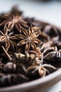 selected star anise stars on a wooden bowl.