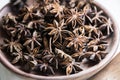 selected star anise stars on a wooden bowl. Royalty Free Stock Photo