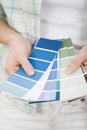 Selecting paint colour for new home. Conceptual image