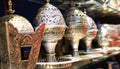 Selection of antique silver lamps at the handicrafts market in Muscat, Oman.