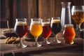 A selection of beers drinks in different glasses wooden table
